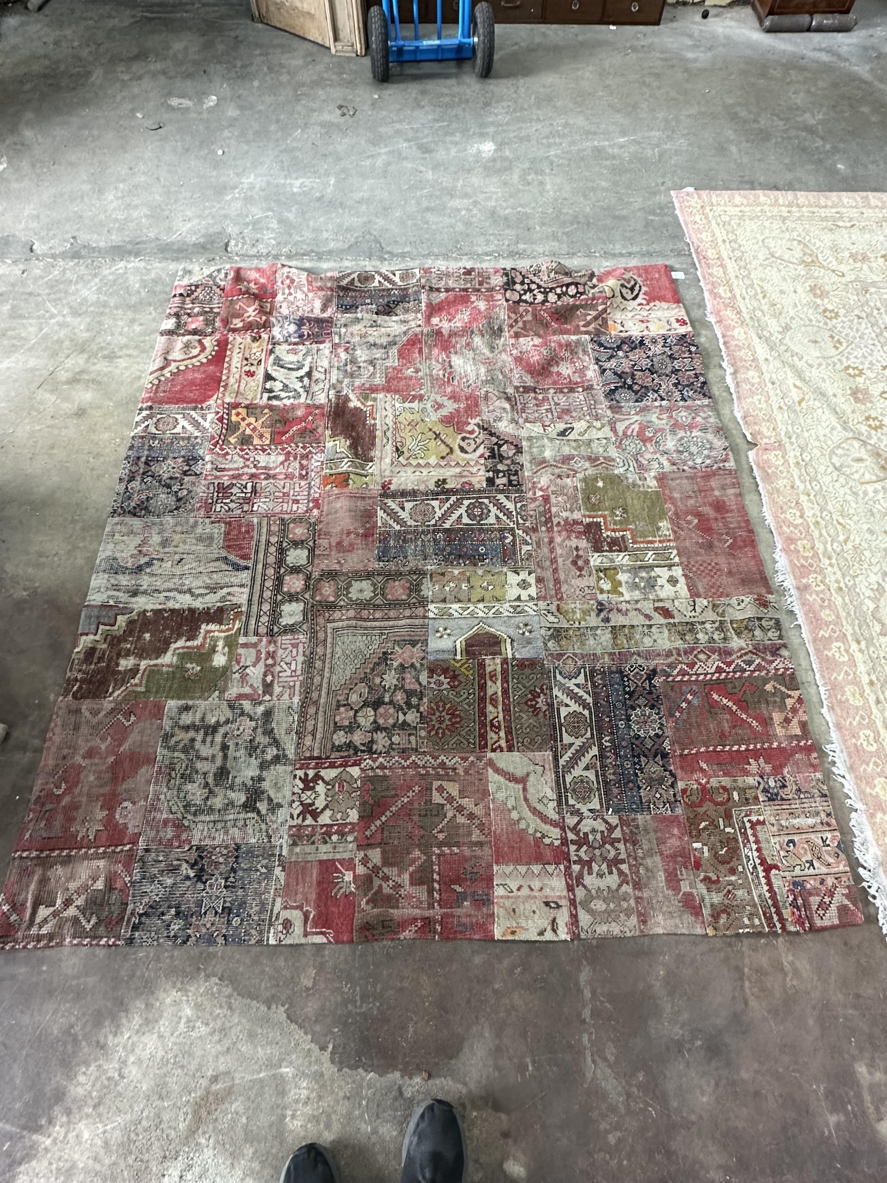 An EthniCon Turkish patchwork rug made from antique carpet fragments, approximately 360 x 200cm. Condition - fair